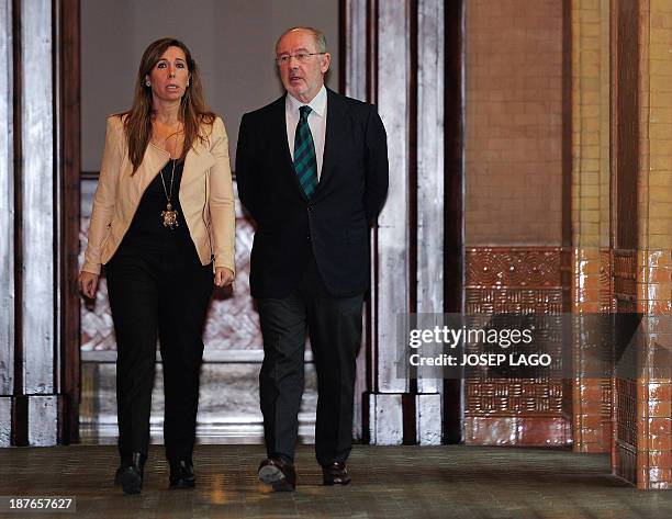 Former Bankia's head Rodrigo Rato , flanked by Popular Party's leader of the Catalonia region Alicia Sanchez Camacho, arrives at the Catalan...