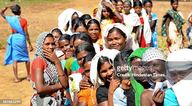 Rural voters standing in queue to cast their vote at a polling booth during the first phase of assembly elections of Chhattisgarh at village on...
