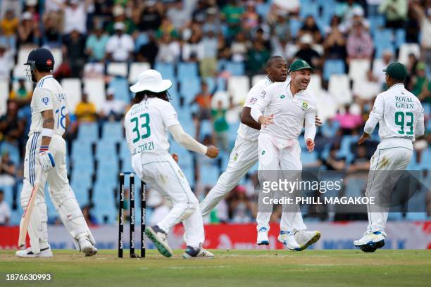 South Africa's Kagiso Rabada , South Africa's Dean Elgar , South Africa's Keegan Petersen and South Africa's Tony de Zorzi celebrate after the...