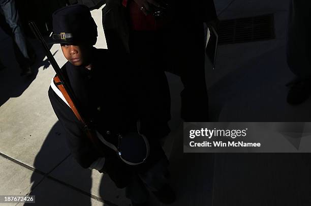 Joshua Terry, dressed in a Civil War era military uniform, enters the African American Civil War Museum after participating in a wreath-laying...