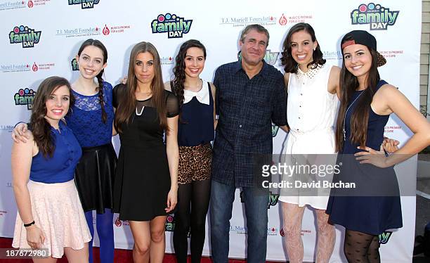 Of Ketchum Sounds and Family Day Chairman Marcus Peterzell with girl Band Cimorelli attend at The T.J. Martell Foundation's Family Day LA at CBS...