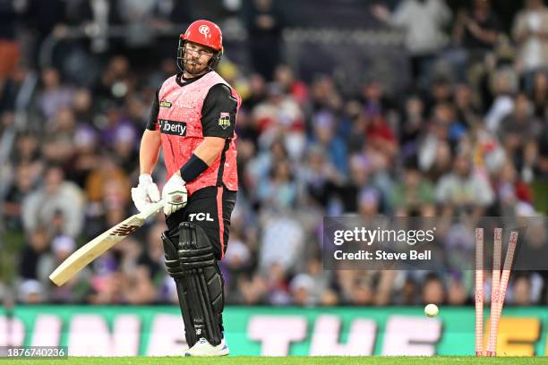 Aaron Finch of the Renegades is bowled by Nathan Ellis of the Hurricanes during the BBL match between Hobart Hurricanes and Melbourne Renegades at...