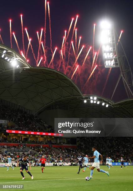 Leo Natel of Melbourne City controls the ball as fireworks go off in the background during the A-League Men round nine match between Melbourne City...