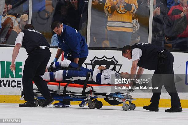 Steven Stamkos of the Tampa Bay Lightning is taken out on a stretcher after hitting his leg on the goal post during a play against the Boston Bruins...