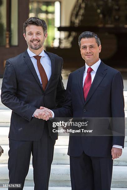 Mexican President Enrique Peña Nieto shakes hands with Frederik André Henrik Christian de Glücksburg crown prince of Denmark, during the welcome...