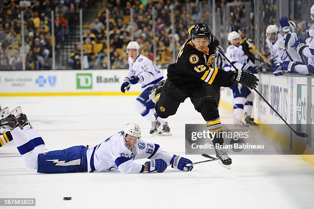 Jarome Iginla of the Boston Bruins skates against Andrej Sustr of the Tampa Bay Lightning at the TD Garden on November 11, 2013 in Boston,...