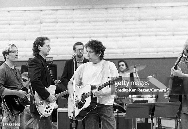 Musicians GE Smith, Bob Dylan and Eric Clapton are photographed behind the scenes of Bob Dylan's 30th Anniversay Concert on October 16, 1992 in New...