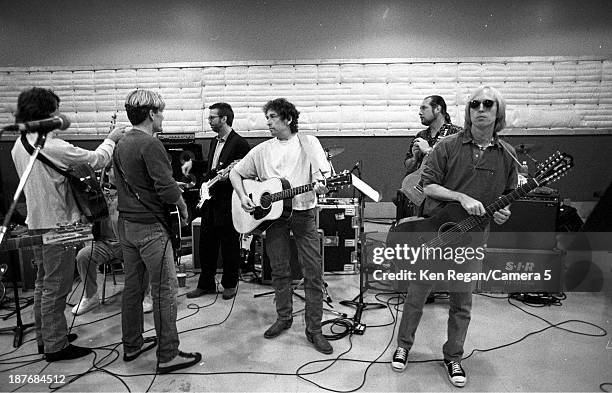 Musicians Eric Clapto, Bob Dylan and Tom Petty are photographed behind the scenes of Bob Dylan's 30th Anniversay Concert on October 16, 1992 in New...