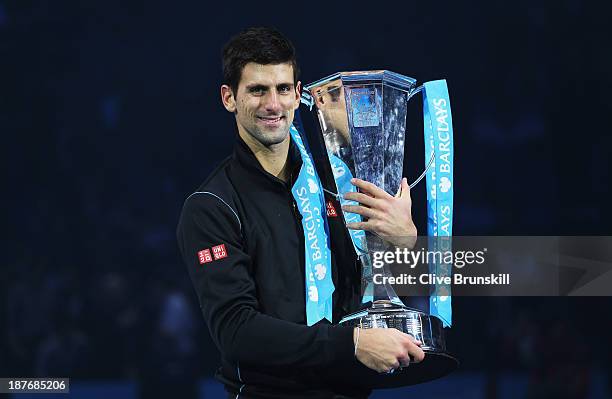 Novak Djokovic of Serbia holds the trophy after his men's singles final match against Rafael Nadal of Spain during day eight of the Barclays ATP...