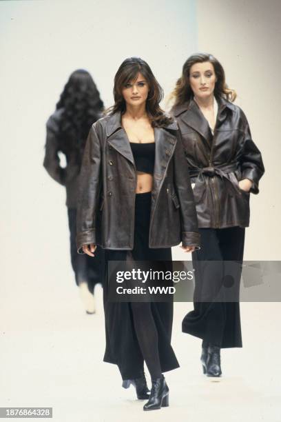 Outtake; Helena Christansen wearing a cropped leather top with a side slit black leather skirt under a leather jacket at Jil Sander's fall show.....