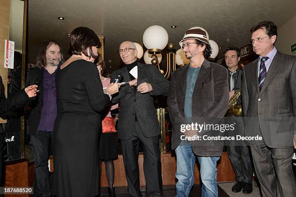 Marcel Cohen and Philippe Rahmy, Prix Wepler winners, posing with Marie-Rose Guarnieri and Michel Bessieres speaking on the Prix Wepler 2013 Literary...