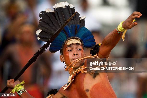 Native from the Brazilian Aknomepa tribe participates in a spear tossing competition during the XII International Games of Indigenous Peoples, in...