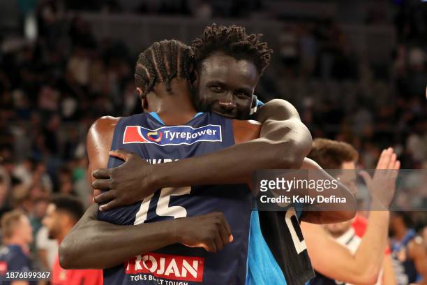 Ariel Hukporti of United and Jo Lual-Acuil Jr of United celebrate the win during the round 12 NBL match between Melbourne United and Perth Wildcats...