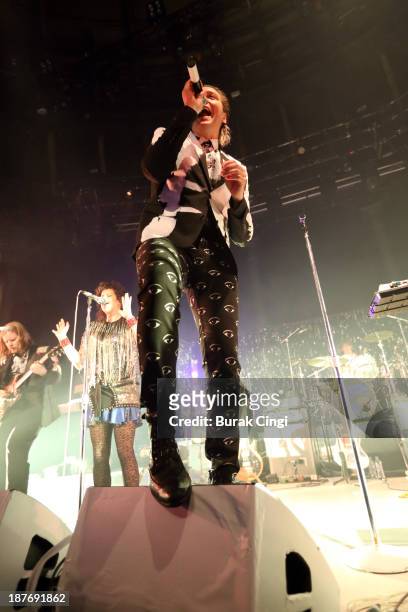 Tim Kingsbury, Win Butker, Jeremy Gara and Richard Parry of Arcade Fire perform on stage at The Roundhouse on November 11, 2013 in London, England.