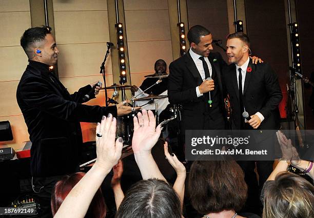 Aston Merrygold, Marvin Humes and Gary Barlow perform at the BBC Children in Need Gala hosted by Gary Barlow at The Grosvenor House Hotel on November...