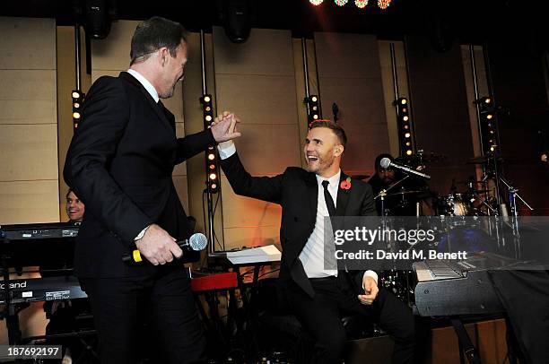 Jason Donovan and Gary Barlow attend the BBC Children in Need Gala hosted by Gary Barlow at The Grosvenor House Hotel on November 11, 2013 in London,...