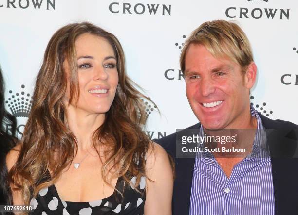 Shane Warne and Elizabeth Hurley pose as they attend the launch of the Shane Warne Foundation's Ambassador Program at Club 23 on November 12, 2013 in...