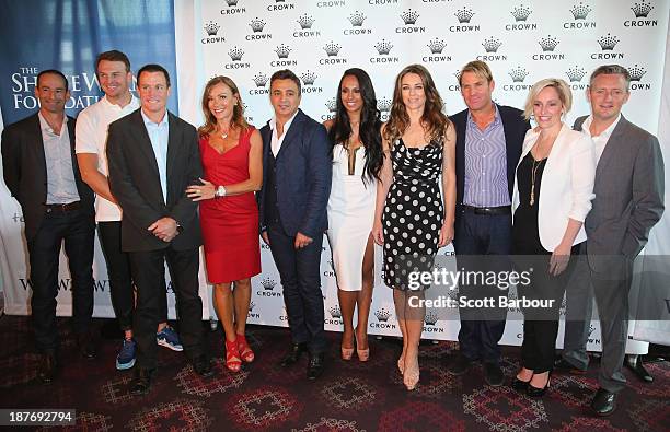 Shane Warne and Elizabeth Hurley pose with Shane Warne Foundation Ambassadors Aaron Hamill, Brendan Goddard and Fifi Box as they attend the launch of...