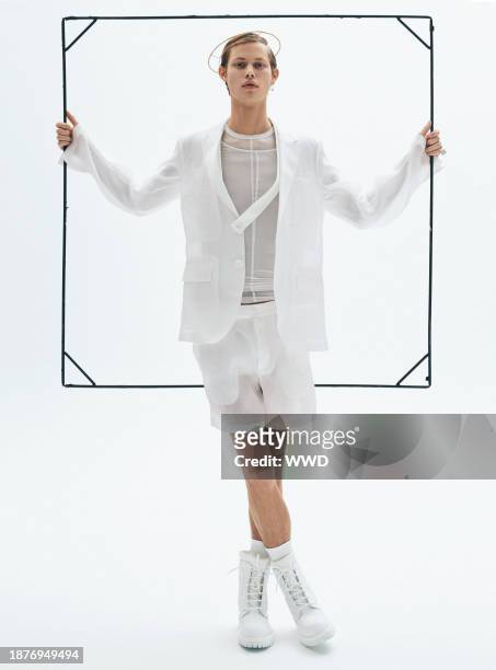 Helmut Lang’s silk organza blazer and shorts and cupro shirting. Wiederhoeft halo; Louis vuitton boots; Laruicci rings; Gucci ring.