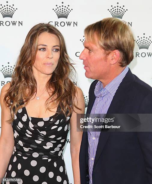 Shane Warne and Elizabeth Hurley pose as they attend the launch of the Shane Warne Foundation's Ambassador Program at Club 23 on November 12, 2013 in...