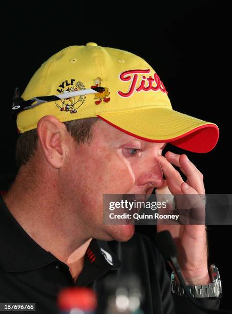 Jarrod Lyle of Australiawipes a tear from his eye as he speaks to the media during previews ahead of the 2013 Australian Masters at Royal Melbourne...