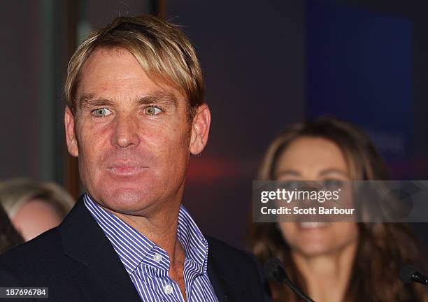 Shane Warne speaks as Elizabeth Hurley looks on during the launch of the Shane Warne Foundation's Ambassador Program at Club 23 on November 12, 2013...