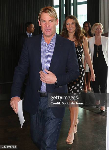Shane Warne and Elizabeth Hurley arrive to attend the launch of the Shane Warne Foundation's Ambassador Program at Club 23 on November 12, 2013 in...