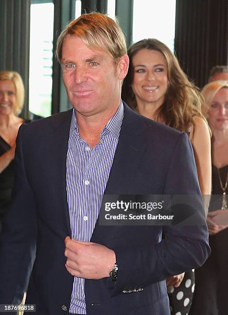 Shane Warne and Elizabeth Hurley arrive to attend the launch of the Shane Warne Foundation's Ambassador Program at Club 23 on November 12, 2013 in...