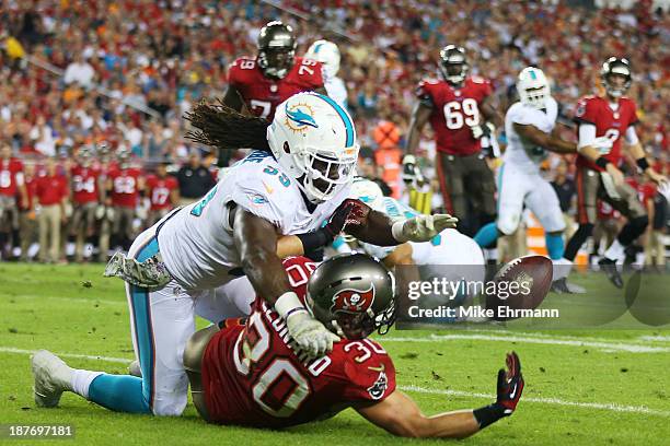 Dannell Ellerbe of the Miami Dolphins breaks up a pass intended for Brian Leonard of the Tampa Bay Buccaneers in the first quarter at Raymond James...