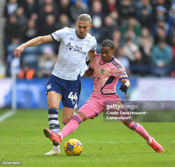 Preston North End's Brad Potts battles with Leeds United's Crysencio Summerville during the Sky Bet Championship match between Preston North End and...