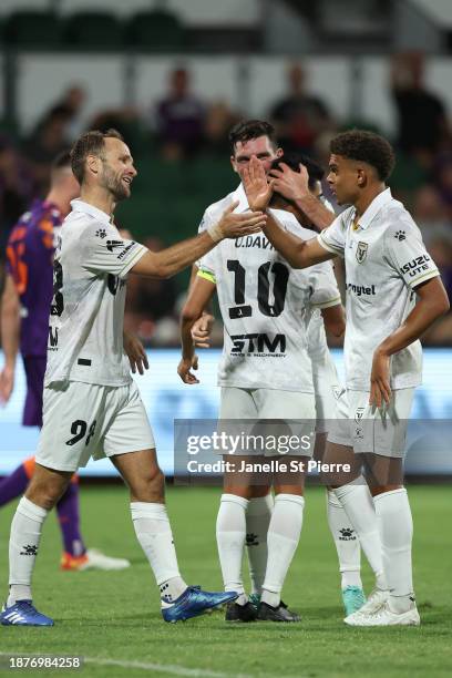 Valere Germain and Raphael of Macarthur FC celebrates a goal with during the A-League Men round nine match between Perth Glory and Macarthur FC at...