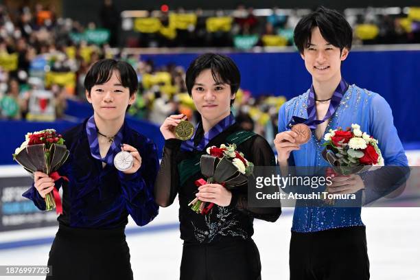 Yuma Kagiyama , Shoma Uno and Sota Yamamoto of Japan pose with medals during day three of the 92nd All Japan Figure Skating Championships at Wakasato...