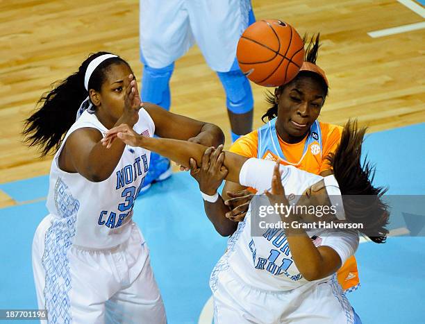 Bashaara Graves of the Tennessee Lady Vols battles for a rebound with Xylina McDaniel and Brittany Rountree of the North Carolina Tar Heels during...