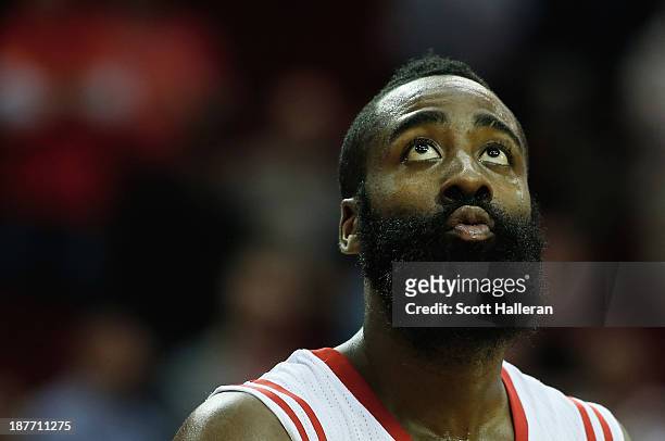James Harden of the Houston Rockets waits under the basket as time winds down in the second overtime period during the game against the Toronto...
