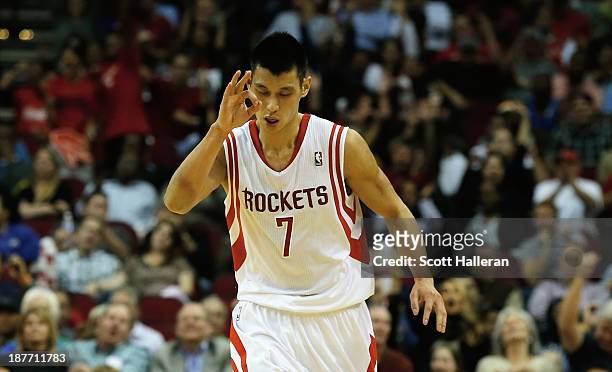 Jeremy Lin of the Houston Rockets celebrates after a three point shot against the Toronto Raptors at Toyota Center on November 11, 2013 in Houston,...