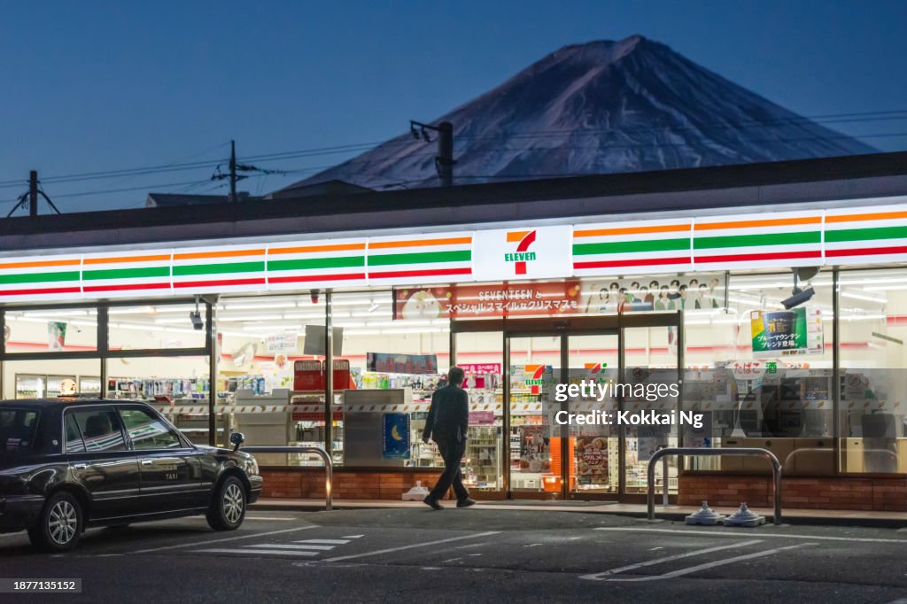 7-Eleven konbini with Mount Fuji behind it, Kawaguchiko, Japan