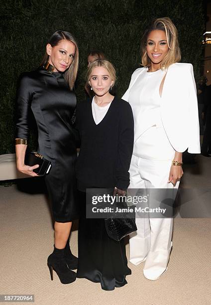 Actress Ashley Olsen and singer Ciara pose with a guest at CFDA and Vogue 2013 Fashion Fund Finalists Celebration at Spring Studios on November 11,...