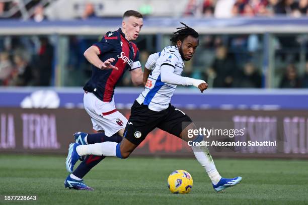 Ademola Lookman of Atalanta BC on the ball whilst under pressure from Lewis Ferguson of Bologna FC during the Serie A TIM match between Bologna FC...