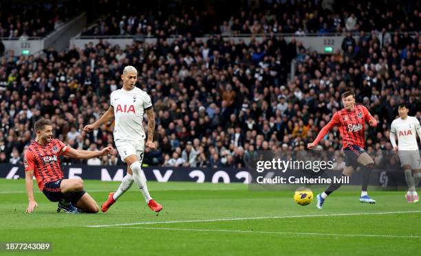 Richarlison of Tottenham Hotspur scores their team's first goal during the Premier League match between Tottenham Hotspur and Everton FC at Tottenham...
