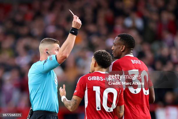 Willy Boly of Nottingham Forest reacts after being shown a red card, following a second yellow card, by Match Referee Robert Jones during the Premier...