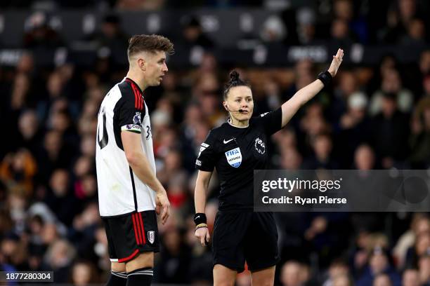 Referee Rebecca Welch gestures during the Premier League match between Fulham FC and Burnley FC at Craven Cottage on December 23, 2023 in London,...