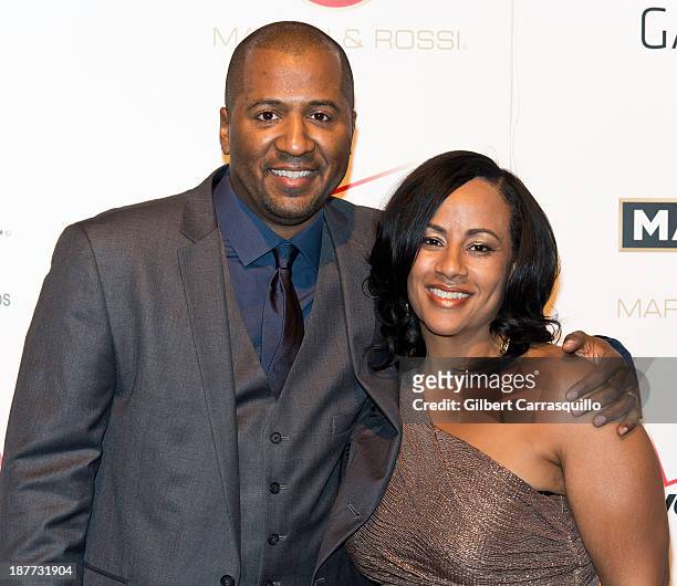 Writer/director Malcolm D. Lee and wife Camille Lee Lee attend "The Best Man Holiday" screening at Chelsea Bow Tie Cinemas on November 11, 2013 in...