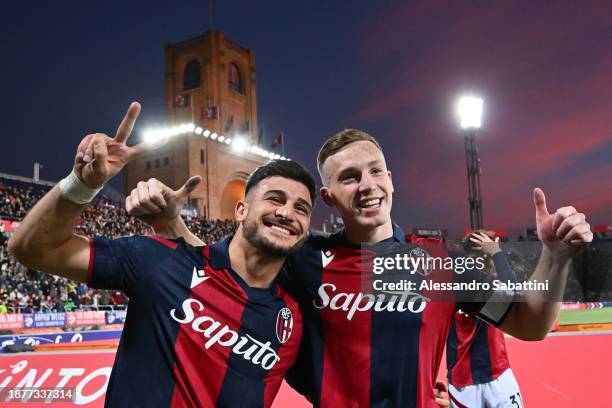 Riccardo Orsolini and Lewis Ferguson of Bologna FC celebrate victory at full-time following the Serie A TIM match between Bologna FC and Atalanta BC...