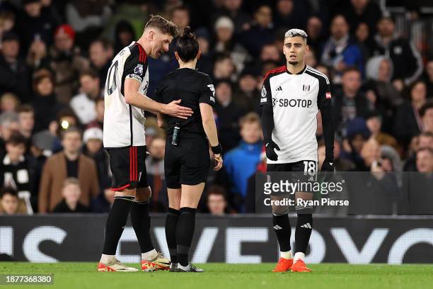 Referee Rebecca Welch interacts with Tom Cairney of Fulham during the Premier League match between Fulham FC and Burnley FC at Craven Cottage on...