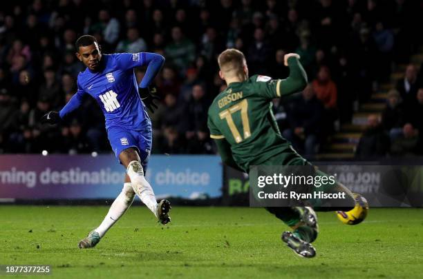 Juninho Bacuna of Birmingham City scores their team's third goal whilst under pressure from Lewis Gibson of Plymouth Argyle during the Sky Bet...