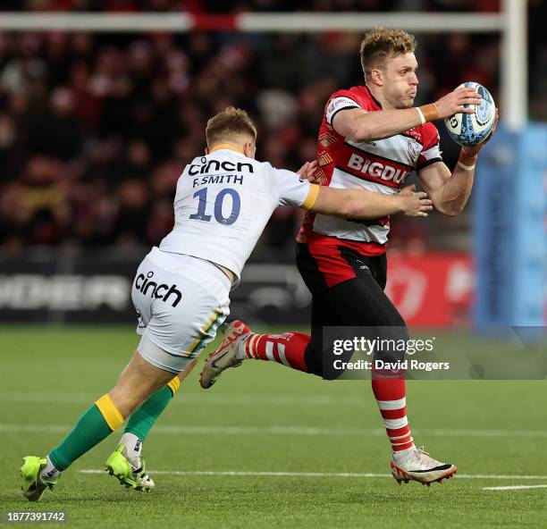 Ollie Thorley of Gloucester is tackled by Fin Smith during the Gallagher Premiership Rugby match between Gloucester Rugby and Northampton Saints at...