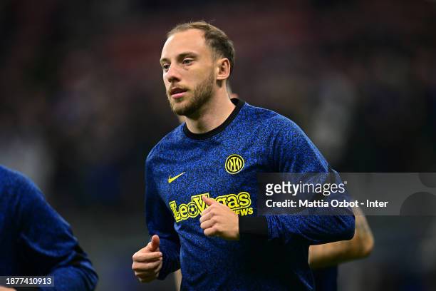 Carlos Augusto of FC Internazionale warms up ahead before the Serie A TIM match between FC Internazionale and US Lecce at Stadio Giuseppe Meazza on...