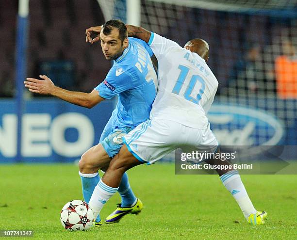 Andrè Ayew of Olympique de Marseille and Goran Pandev of SSC Napoli in action during the UEFA Champions League Group F match between SSC Napoli and...