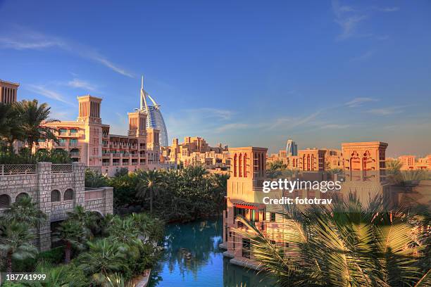 madinat jumeira resort, arabic style cityscape, dubai - dubai water canal stock pictures, royalty-free photos & images