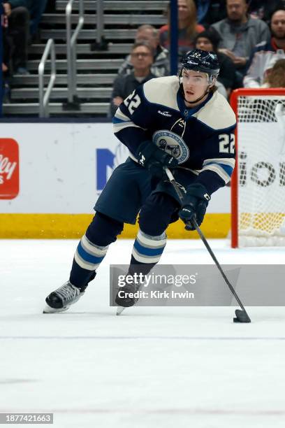 Jake Bean of the Columbus Blue Jackets controls the puck during the game against the Washington Capitals at Nationwide Arena on December 21, 2023 in...